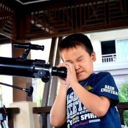 telescope and young kid